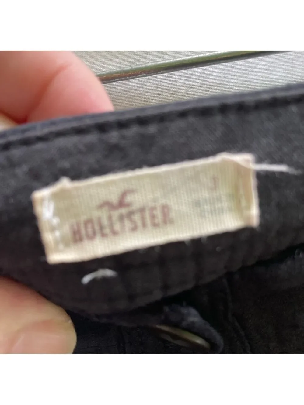 Hollister black mini skirt with buttons, size 3